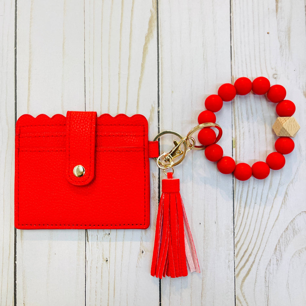 NC State gift box detail showing Raleigh sticker and card holder wristlet