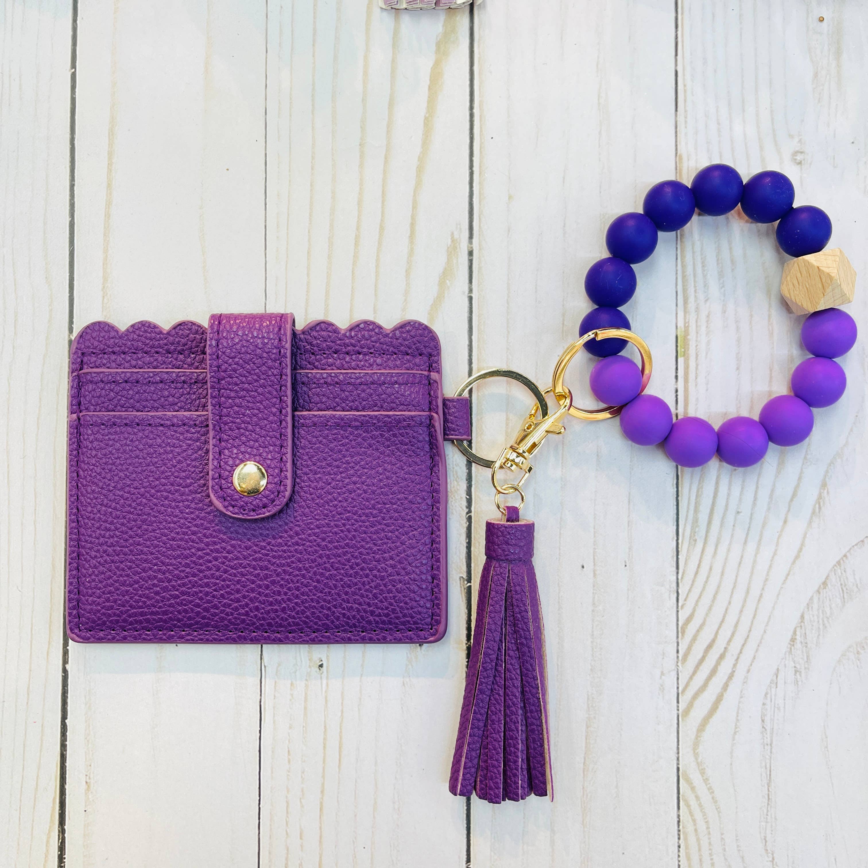 ECU gift box detail showing card holder wristlet and purple North Carolina sticker