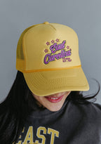 ECU Next Chapter gift box lifestyle flat lay with East Carolina purple and gold accessories