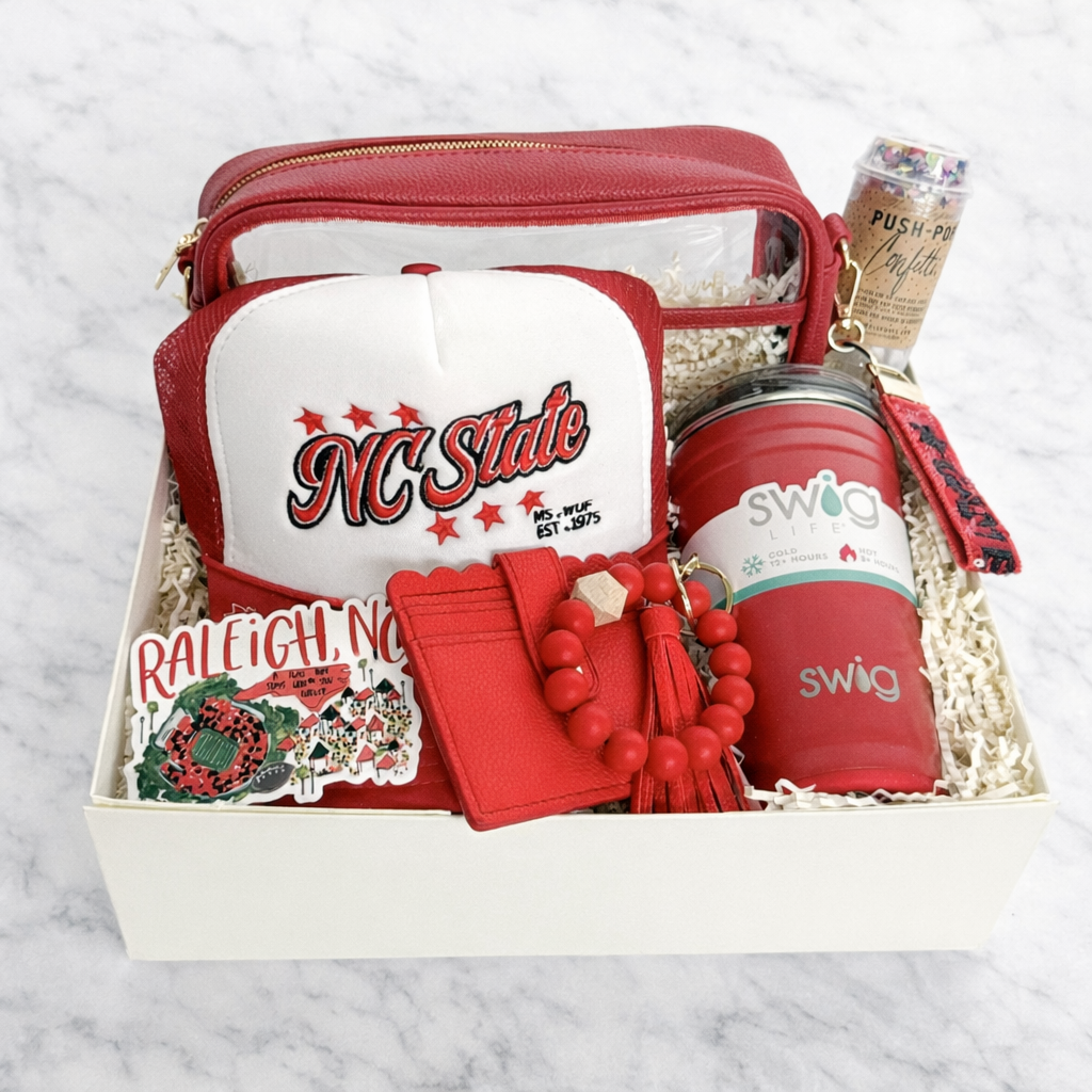 NC State deluxe graduation gift box with Wolfpack red ribbon, Swig tumbler, trucker hat and stadium bag
