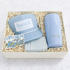 UNC graduation gift box with Swig tumbler, Chapel Hill hat and zip wallet in Tar Heel blue