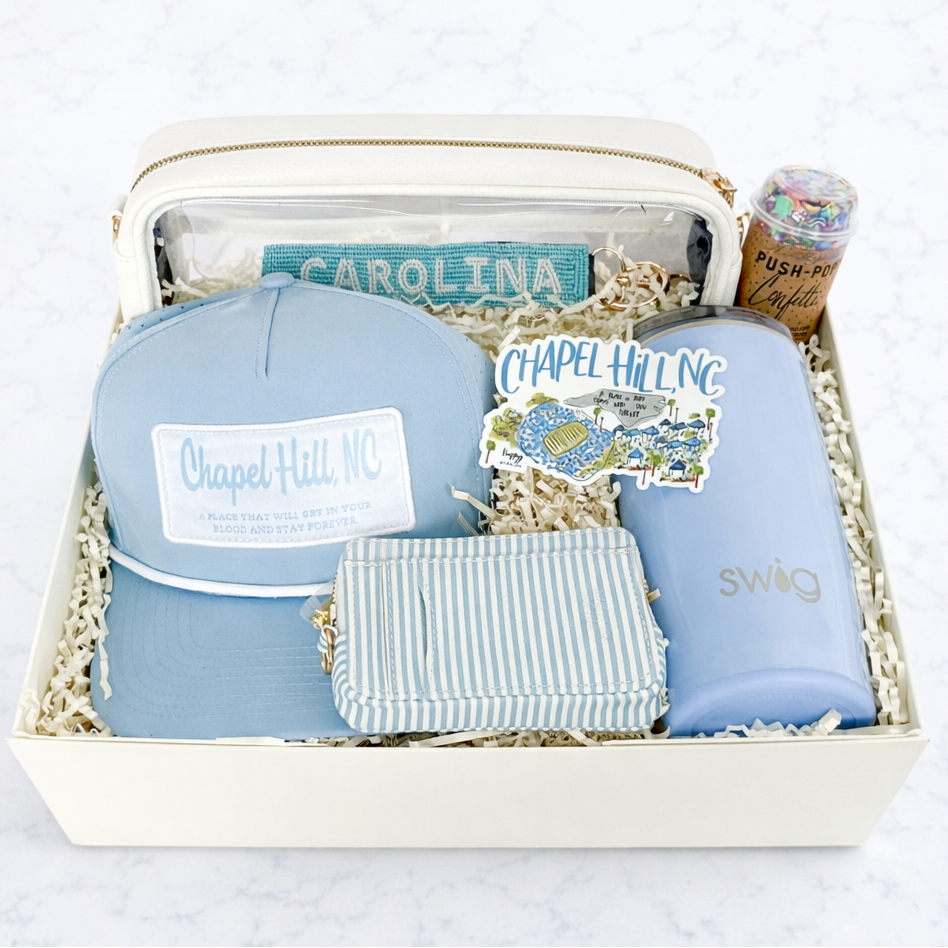 UNC deluxe graduation gift box with Tar Heel blue ribbon, Swig tumbler, Chapel Hill hat and stadium bag