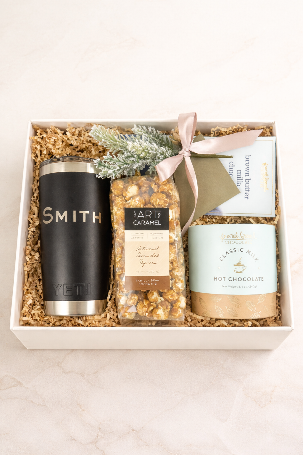 The Evergreen luxury gift box with customized YETI 20oz tumbler, hot chocolate and artisan popcorn
